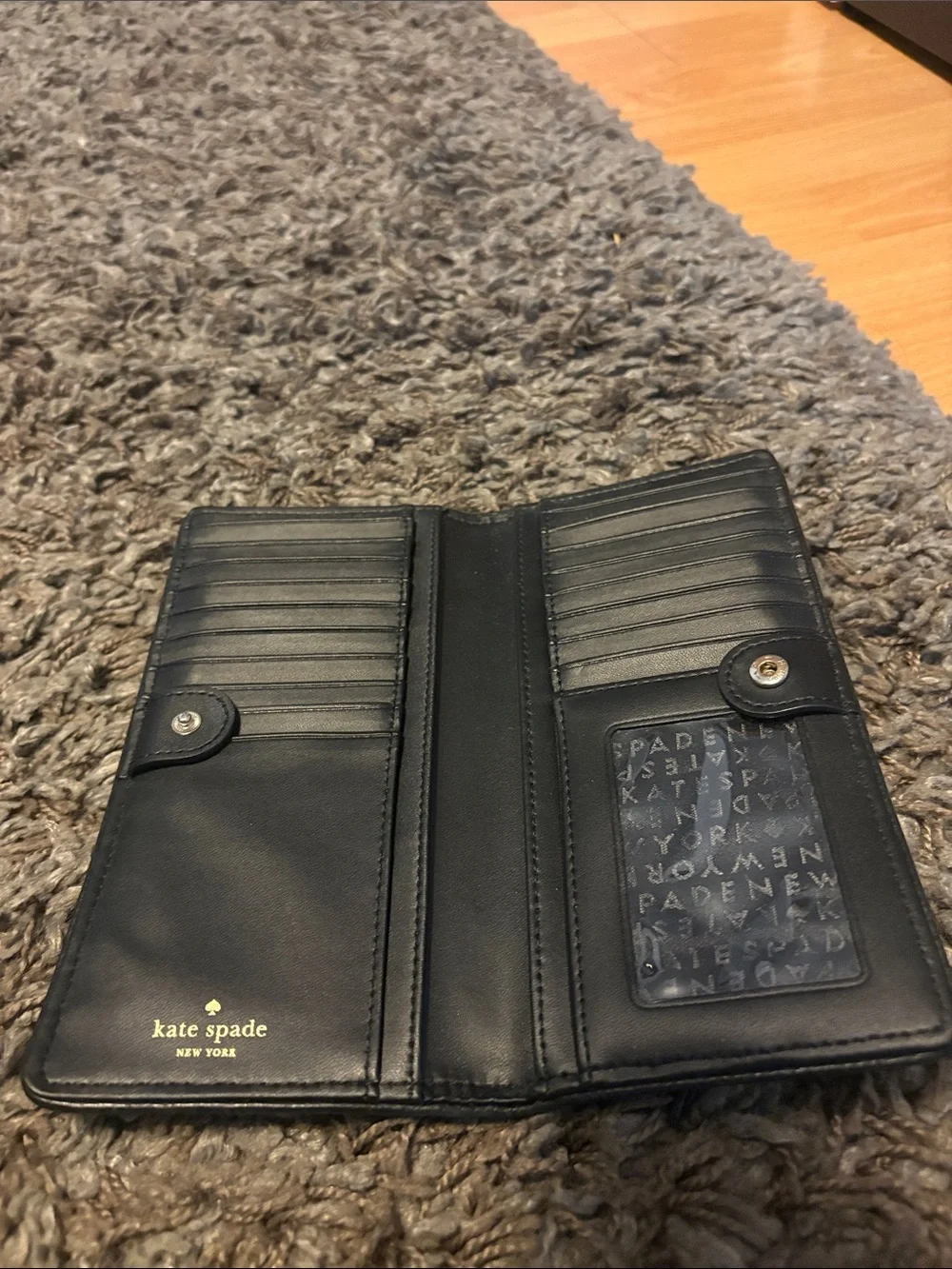 kate spade Pebbled Black Leather Continental Wallet with Gold Logo
